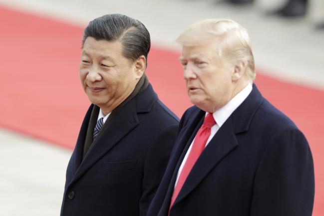 © Bloomberg. Xi Jinping and Donald Trump on Nov. 9, 2017. Photographer: Qilai Shen/Bloomberg