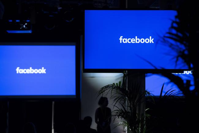 © Bloomberg. The Facebook Inc. logo sits on screens ahead of the global launch event of 