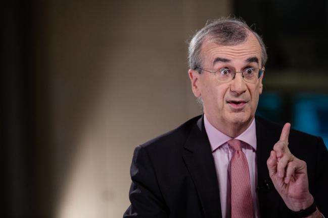 © Bloomberg. Francois Villeroy de Galhau, governor of the Bank of France, gestures while speaking during a Bloomberg Television interview at the French central bank and Global Interdependance Center (GIC) conference in Paris, France, on Monday, May 14, 2018. European Central Bank policy maker Villeroy said the first interest-rate increase could come “some quarters, but not years” after policy makers end their bond-buying program. 