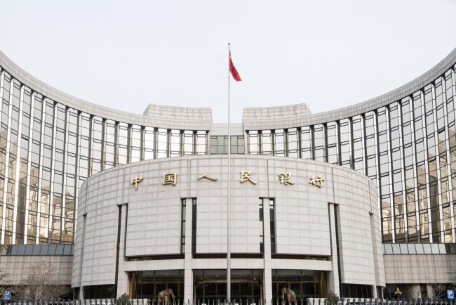 © Bloomberg. The People's Bank of China headquarters stands in Beijing, China, on Monday, Jan. 7, 2019. The central bank on Friday announced another cut to the amount of cash lenders must hold as reserves in a move to release a net 800 billion yuan ($117 billion) of liquidity and offset a funding squeeze ahead of the Chinese New Year. 