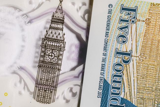 © Bloomberg. The Elizabeth Tower, also known as Big Ben, is seen on a British five pound banknote, in this arranged photograph in London, U.K., on Thursday, Oct. 13, 2016. The U.K. currency is getting harder to trade, and to predict, because the nation’s exit from the European Union has changed the rules of engagement. 