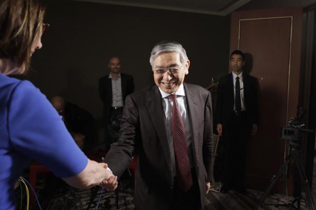 © Bloomberg. Kuroda greets before a Bloomberg Television interview. Photographer: Kiyoshi Ota/Bloomberg