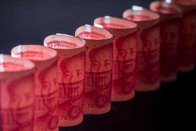 © Bloomberg. Chinese one-hundred yuan banknotes are arranged for a photograph in Hong Kong, China, on Monday, April 15, 2019. China's holdings of Treasury securities rose for a third month as the Asian nation took on more U.S. government debt amid the trade war between the world’s two biggest economies. Photographer: Paul Yeung/Bloomberg