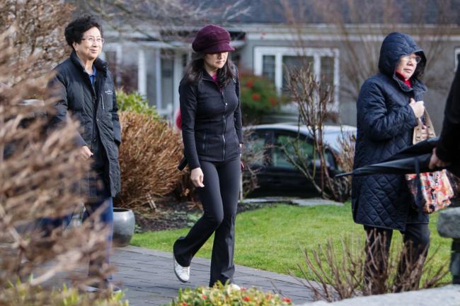 © Bloomberg. Meng Wanzhou leaves her home while out on bail in Vancouver. Photographer: Ben Nelms/Bloomberg