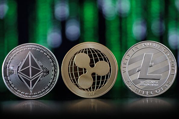 © Bloomberg. LONDON, ENGLAND - APRIL 25: In this photo illustration of the ethereum, ripple and litecoin cryptocurrency 'altcoins' sit arranged for a photograph on April 25, 2018 in London, England. Cryptocurrency markets began to recover this month following a massive crash during the first quarter of 2018, seeing more than $550 billion wiped from the total market capitalisation. (Photo by Jack Taylor/Getty Images)