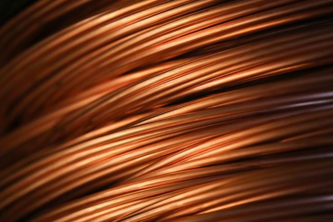 © Bloomberg. Copper wire rod sits in a storage facility following manufacture at the Uralelectromed OJSC Copper Refinery, operated by Ural Mining and Metallurgical Co. (UMMC), in Verkhnyaya Pyshma, Russia, on Tuesday, March 7, 2017.