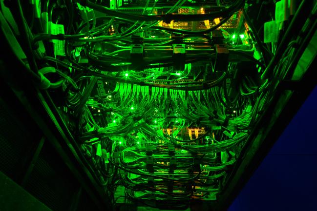 © Bloomberg. Green light illuminates data rack servers in the server room of the Sberbank PJSC data processing center (DPC) at the Skolkovo Innovation Center, in Moscow, Russia, on Tuesday, Dec. 26, 2017. Sberbank PJSC, Russia’s most valuable company, will boost its dividend payout to 50 percent of profit or higher, just not as quickly as some investors had hoped.
