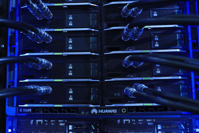 © Bloomberg. Blue light illuminates cables on an E9000 blade server rack, manufactured by Huawei Technologies Co. Ltd., at the CeBIT 2017 tech fair in Hannover, Germany, on Monday, March 20, 2017. Leading edge technologies in the digital world are showcased in this annual event which runs March 20 - 24.