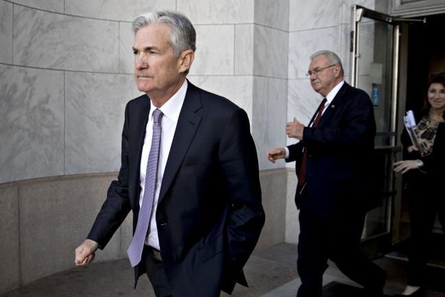 © Bloomberg. Jerome Powell, chairman of the U.S. Federal Reserve, walks out of the Rayburn House Office building after a House Financial Services Committee hearing in Washington, D.C., U.S., on Tuesday, Feb. 27, 2018. Powell said the central bank can continue gradually raising interest rates as the outlook for growth remains strong, and the recent bout of financial volatility shouldn't weigh on the U.S. economy.