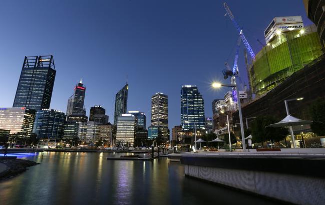 © Bloomberg. Commercial buildings stand in the central business district of Perth, Australia, on Wednesday, April 11, 2018. Australia is scheduled to release employment figures on April 19. Photographer: Sergio Dionisio/Bloomberg