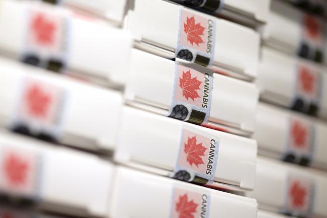 © Bloomberg. Boxes of pre-rolled joints sit stacked at a Quebec Cannabis Society (SQDC) store during a media preview event in Montreal, Quebec, Canada, on Tuesday, Oct. 16, 2018. The SQDC will have twelve stores open in Montreal, as cannabis becomes legal in Canada on October 17. Photographer: Christinne Muschi/Bloomberg