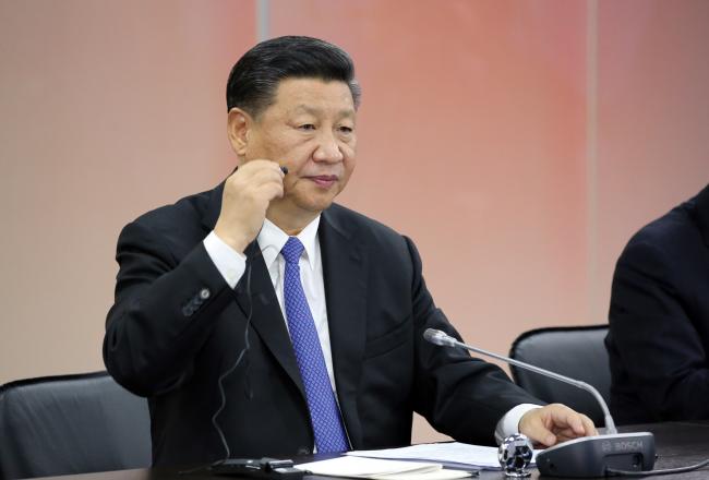 © Bloomberg. Xi Jinping, China's president, adjusts his earpiece during a session on the opening day of the Eastern Economic Forum in Vladivostok, Russia, on Tuesday, Sept. 11, 2018.  Photographer: Andrey Rudakov/Bloomberg