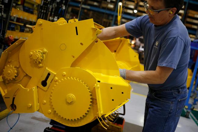 © Bloomberg. A worker assembles components for a New Holland Ltd. round baler at the company's Haytools factory in New Holland, Pennsylvania, U.S., on Friday, April 8, 2016. The Federal Reserve is scheduled to release industrial production figures on April 15.