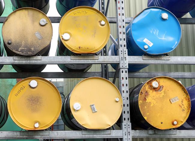 © Bloomberg. Barrels of refined oil and lubricant additives sit on shelves in the storage yard at Rock Oil Ltd.'s factory in Warrington, U.K., on Monday, March 13, 2017. Oil declined after Saudi Arabia told OPEC it raised production back above 10 million barrels a day in February, reversing about a third of the cuts it made the previous month. 