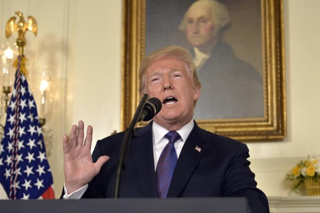© Bloomberg. U.S. President Donald Trump speaks during a televised statement at the White House in Washington, D.C., U.S., on Friday, April 13, 2018. Photographer: Mike Theiler/UPI
