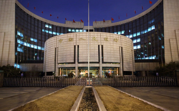 © Bloomberg. The People's Bank Of China (PBOC) headquarters stand at night in the financial district of Beijing, China. Photographer: Tomohiro Ohsumi/Bloomberg