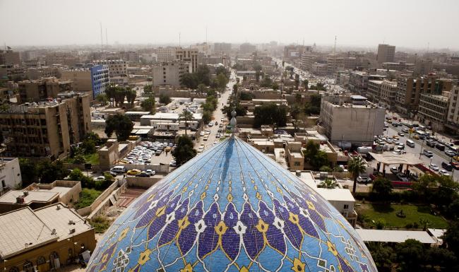 © Bloomberg. A general view of downtown Baghdad with the Dome of the 17 Ramadann Mosque. 