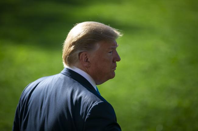 © Bloomberg. U.S. President Donald Trump walks on the South Lawn of the White House to board Marine One in Washington, D.C., U.S., on Wednesday, April 10, 2019. On Wednesday, President Trump is poised to issue two executive orders to promote energy infrastructure, including projects like the long-stalled Constitution Pipeline, according to an administration official. Photographer: Al Drago/Bloomberg