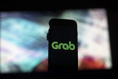 Bloomberg: Uber đồng ý bán lại mảng kinh doanh ở Đông Nam Á cho Grab