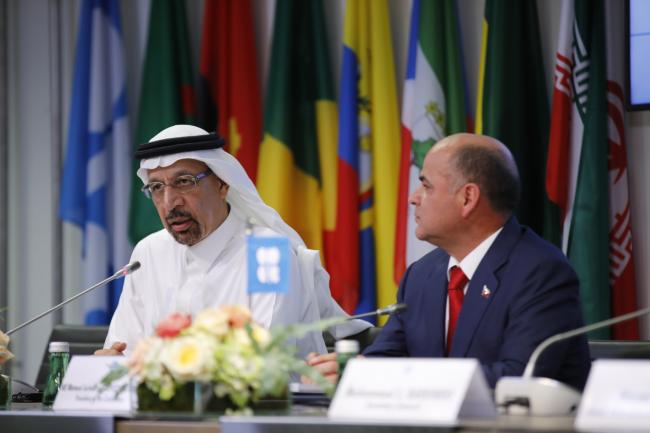 © Bloomberg. Khalid Al-Falih, Saudi Arabia's energy and industry minister, left, speaks while Manuel Quevedo, Venezuela's petroleum minister and president of the Organization of Petroleum Exporting Countries (OPEC), listens at a news conference following the 176th OPEC meeting in Vienna, Austria, on Monday, July 1, 2019. OPEC will extend production cuts into 2020 as the world's leading oil exporters fret about a weakening outlook for global demand growth and the relentless rise in output from America's shale fields. Photographer: Stefan Wermuth/Bloomberg
        