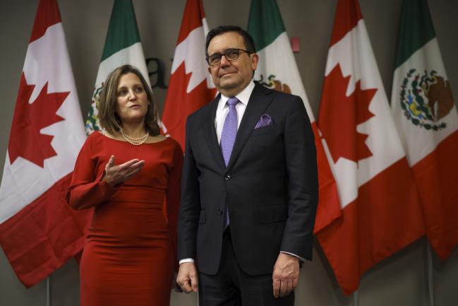 © Bloomberg. Chrystia Freeland, left, with Ildefonso Guajardo Villarreal in Toronto on Jan. 22. Photographer: Cole Burston/Bloomberg