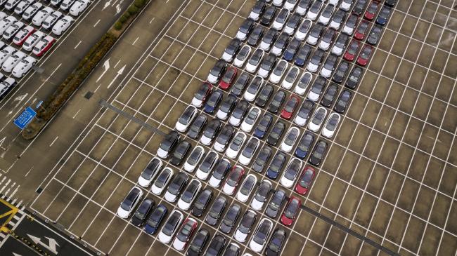 &copy Bloomberg. Tesla electric vehiclesparked at a port in Shanghai. 