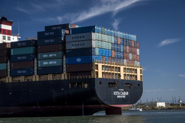 &copy Bloomberg. Shipping containers sit stacked on the Kota Cabar cargo ship at the Port of Oakland in Oakland, California, U.S., on Tuesday, July 17, 2018. The U.S. Census Bureau is scheduled to release trade balance figures on August 3. 