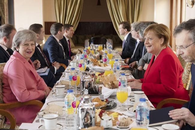 © Bloomberg. SHARM EL SHEIKH, EGYPT - FEBRUARY 25: German Chancellor Angela Merkel, and British Prime Minster Theresa May (L) hold bilateral talks over breakfast during the first Arab-European Summit on February 25, 2019 in Sharm El Sheikh, Egypt. Leaders from European and Arab nations are meeting for the two-day summit to discuss topics including security, trade and migration. (Photo by Dan Kitwood/Getty Images) Photographer: Dan Kitwood/Getty Images Europe