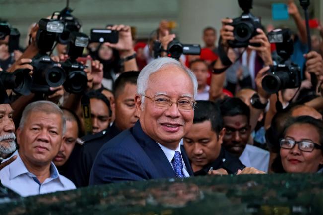 © Bloomberg. Najib Razak leaves Kuala Lumpur Courts Complex on April 3. Photographer: Samsul Said/Bloomberg