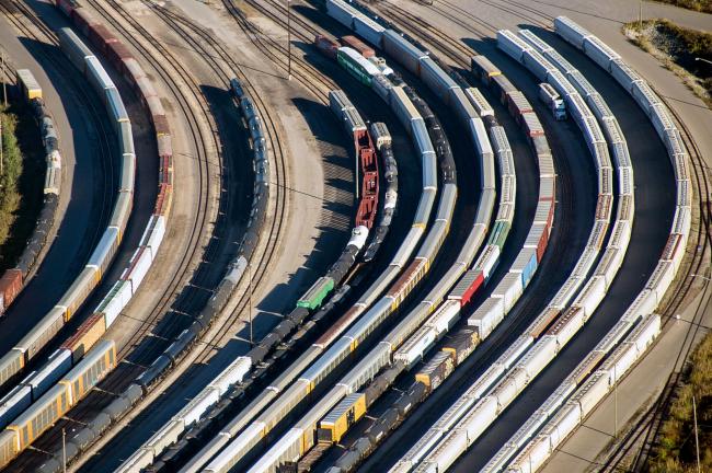 © Bloomberg. Freight trains and oil tankers sit in a rail yard in this aerial photograph taken above Toronto, Ontario, Canada, on Monday, Oct. 2, 2017. Canada's trade picture continued to deteriorate in August as exports dropped for a third straight month and the deficit unexpectedly widened.