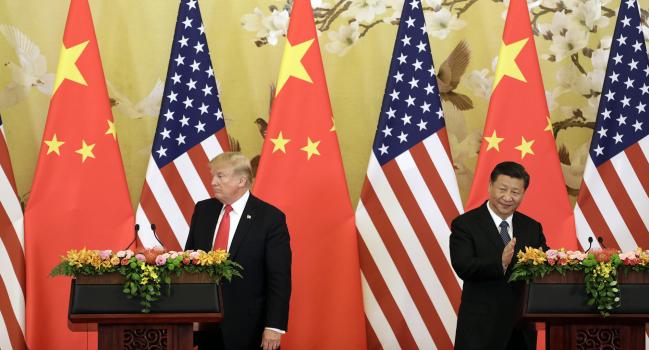 © Bloomberg. U.S. President Donald Trump, left, and Xi Jinping, China's president, attend a news conference at the Great Hall of the People in Beijing, China, on Thursday, Nov. 9, 2017. 