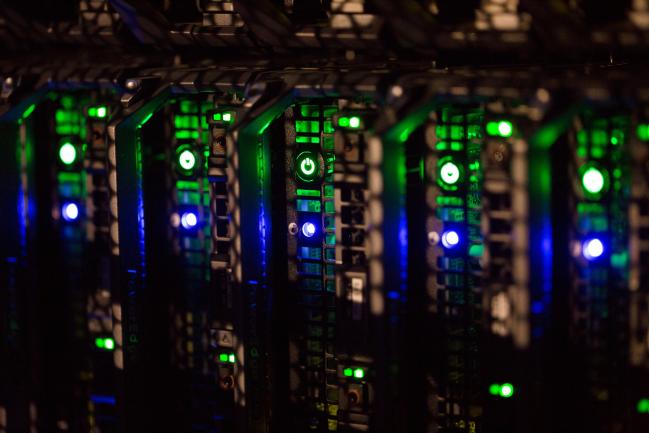 © Bloomberg. Lights illuminate control buttons on rack server devices. Photographer: Andrey Rudakov/Bloomberg