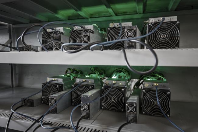 © Bloomberg. Bitcoin mining machines operate at a mining facility by Bitmain Technologies Ltd. in Ordos, Inner Mongolia, China, on Friday, Aug. 11, 2017. Bitmain is one of the leading producers of bitcoin-mining equipment and also runs Antpool, a processing pool that combines individual miners from China and other countries, in addition to operating one of the largest digital currency mines in the world.