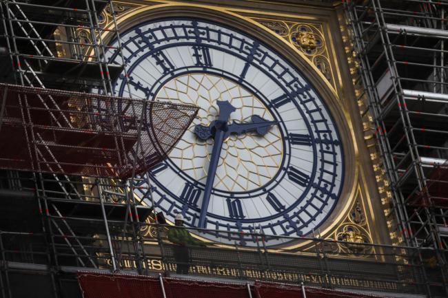 © Bloomberg. Scaffolding surrounds the clock face on the Elizabeth Tower, also known as Big Ben, of the Houses of Parliament in the Westminster district of London, U.K.  Photographer: Simon Dawson/Bloomberg