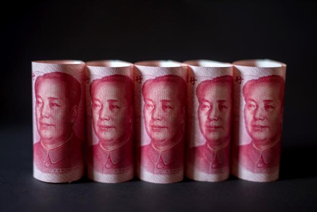 © Bloomberg. Chinese one-hundred yuan banknotes are arranged for a photograph in Hong Kong, China, on Monday, April 15, 2019. China's holdings of Treasury securities rose for a third month as the Asian nation took on more U.S. government debt amid the trade war between the world’s two biggest economies. 