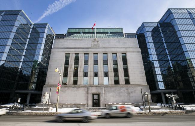 &copy Bloomberg. Vehicles drive past the Bank of Canada offices in Ottawa, Ontario, Canada, on Monday, March 20, 2017.