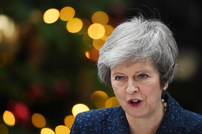 &copy Bloomberg. LONDON, ENGLAND - DECEMBER 12: Prime Minister Theresa May makes a statement in Downing Street after it was announced that she will face a vote of no confidence, to take place tonight, on December 12, 2018 in London, England. Sir Graham Brady, the chairman of the 1922 Committee, has received the necessary 48 letters (15% of the parliamentary party) from Conservative MP's that will trigger a vote of no confidence in the Prime Minister. (Photo by Leon Neal/Getty Images) 