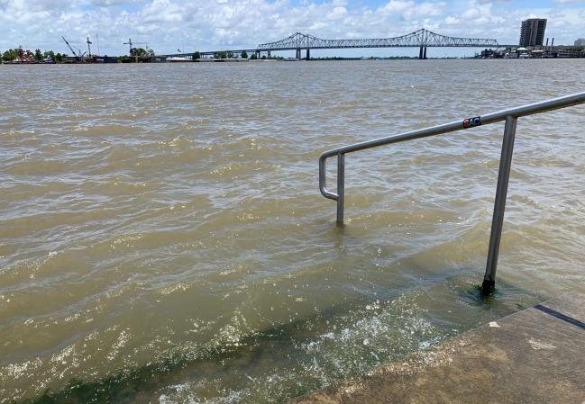 © Bloomberg. The Mississippi River laps at the stairs on a protective levee in New Orleans as tropical storm Barry approaches on July 11, 2019.  