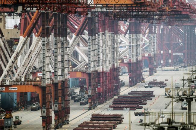 © Bloomberg. Gantry cranes stand at the Yangshan Deepwater Port, operated by Shanghai International Port Group Co. (SIPG), in Shanghai, China, on Friday, May 10, 2019. The U.S. hiked tariffs on more than $200 billion in goods from China on Friday in the most dramatic step yet of President Donald Trump's push to extract trade concessions, deepening a conflict that has roiled financial markets and cast a shadow over the global economy. 