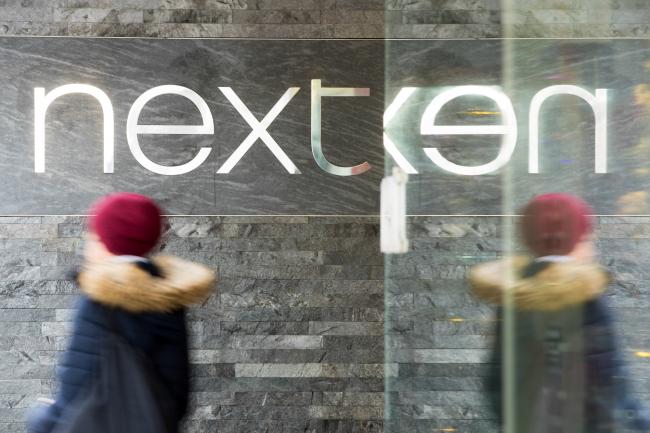 © Bloomberg. A pedestrian passes a sign at a Next Plc clothing retail store in London, U.K. on Monday, Nov. 5, 2018. U.K. retail sales growth weakened in October after a summer of strong spending, according to the Confederation of British Industry. Photographer: Jason Alden/Bloomberg
