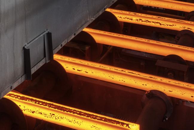 &copy Bloomberg. Hot steel bars pass along the continuous casting production line at the ArcelorMittal steel plant in Kryvyi Rih, Ukraine, on Wednesday, March 6, 2019. ArcelorMittal has made an offer of 48 billion rupees ($672 million) to buy an Essar Power generation plant in India, outbidding the founding Ruia brothers, according to people with knowledge of the matter. 