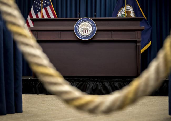 © Bloomberg. An empty desk sits ahead of a news conference following a Federal Open Market Committee (FOMC) meeting in Washington, D.C., U.S., on Wednesday, June 14, 2017. Federal Reserve officials forged ahead with an interest-rate increase and additional plans to tighten monetary policy despite growing concerns over weak inflation.