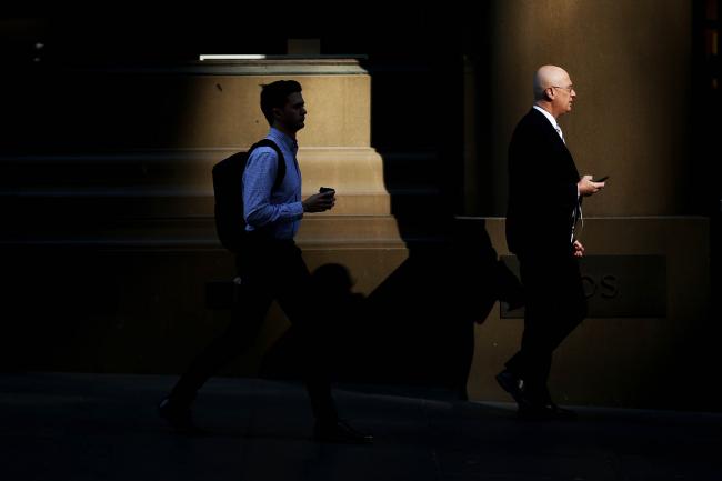 © Bloomberg. Morning commuters walk through Martin Place in Sydney, Australia, on Thursday, Aug. 17, 2017. Australian employers added more jobs than forecast in July, underscoring the central banks confidence in an improving labor market.