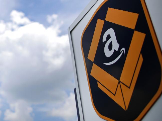 © Bloomberg. The Amazon.com logo is displayed outside the company's fulfillment center in Kenosha, Wisconsin, U.S. Photographer: Jim Young/Bloomberg