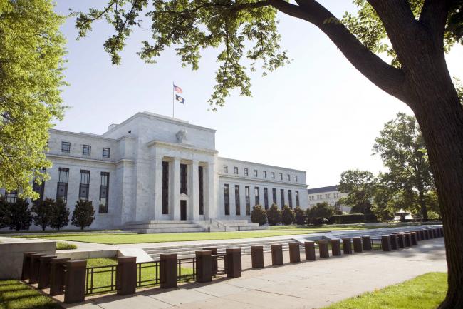 © Bloomberg. UNITED STATES - JUNE 24:  The U.S. Federal Reserve Building stands in Washington, D.C., U.S., on Wednesday, June 24, 2009. Federal Reserve officials will probably seek today to reassure investors they can keep short-term interest rates at a record low without igniting inflation.  (Photo by Brendan Smialowski/Bloomberg via Getty Images)
