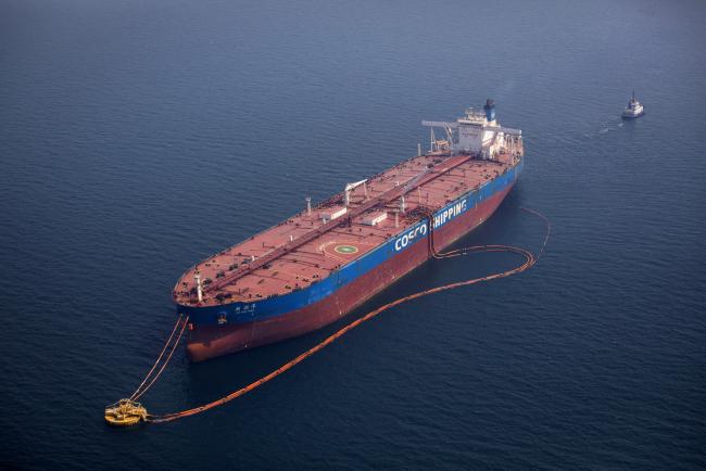 Â© Bloomberg. The 'Xin Run Yang' oil tanker, operated by Cosco Shipping Holdings Co., rides its mooring while being loaded with crude oil near Saudi Aramco's Ras Tanura oil refinery, in Ras Tanura, Saudi Arabia, on Wednesday, Oct. 3, 2018. Saudi Aramco aims to become a global refiner and chemical maker, seeking to profit from parts of the oil industry where demand is growing the fastest while also underpinning the kingdomâ€™s economic diversification. Photographer: Simon Dawson/Bloomberg