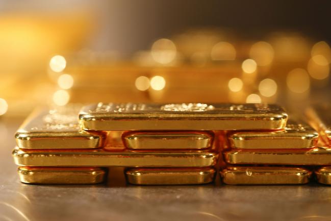 Gold Erases Gains as Trump Ratchets Down China Trade-War Tension