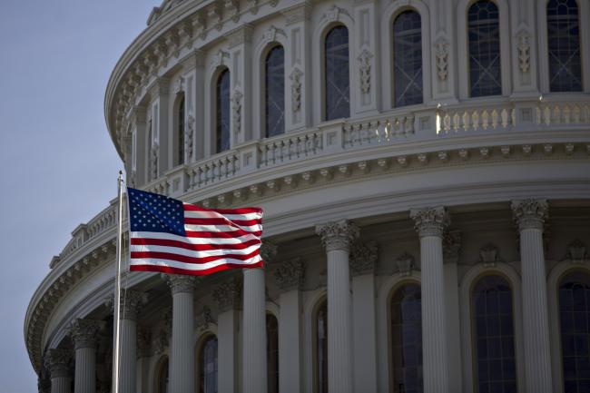 © Bloomberg. The American flag flies next to the dome of the U.S. Capitol building during rehearsal for the 2017 Inaugural Ceremonies in Washington, D.C., U.S., on Sunday, Jan. 15, 2017. Donald Trump becomes the 45th U.S. president on January 20, the first billionaire to occupy the White House and just the fourth person elected to the office after losing his home state. 