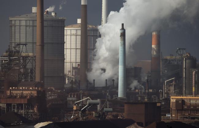 © Bloomberg. Emissions rise from chimneys at the Nippon Steel & Sumitomo Metal Corp. plant stands in Kashima, Ibaraki, Japan, on Wednesday, April 18, 2018. President Donald Trump and Japanese Prime Minister Shinzo Abe committed Wednesday to intensify bilateral trade talks. Trump is pushing for an agreement that would reduce the U.S. trade deficit with Japan, while Abe is seeking an exemption from the steel and aluminum tariffs that Trump announced last month. Photographer: Tomohiro Ohsumi/Bloomberg