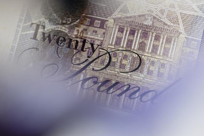 © Bloomberg. An engraving showing the headquarters of the Bank of England is seen on a British twenty pound banknote, in this arranged photograph in London, U.K., on Thursday, Oct. 13, 2016. The U.K. currency is getting harder to trade, and to predict, because the nation’s exit from the European Union has changed the rules of engagement. Photographer: Miles Willis/Bloomberg
